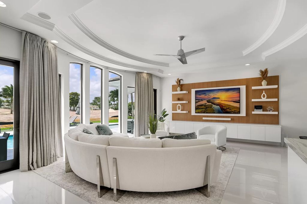 The Home in Boca Raton is a Two story Transitional Contemporary with exceptional water and expansive golf course vistas of the Fazio west golf course now available for sale. This home located at 7645 Fenwick Pl, Boca Raton, Florida