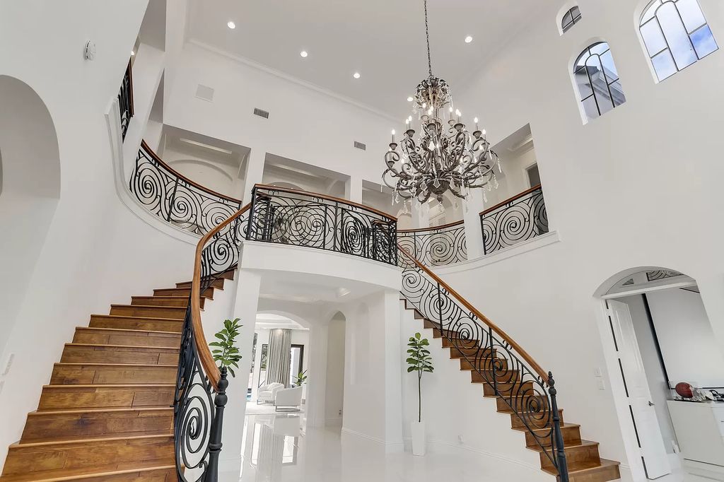 The Home in Boca Raton is a Two story Transitional Contemporary with exceptional water and expansive golf course vistas of the Fazio west golf course now available for sale. This home located at 7645 Fenwick Pl, Boca Raton, Florida