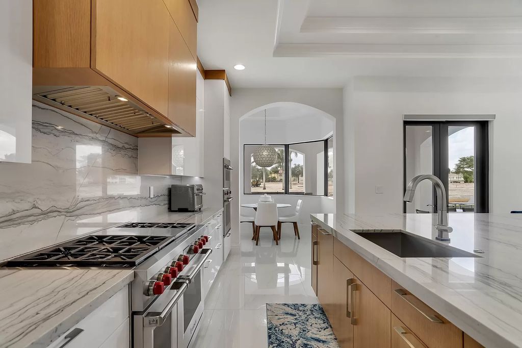 The Home in Boca Raton is a Two story Transitional Contemporary with exceptional water and expansive golf course vistas of the Fazio west golf course now available for sale. This home located at 7645 Fenwick Pl, Boca Raton, Florida