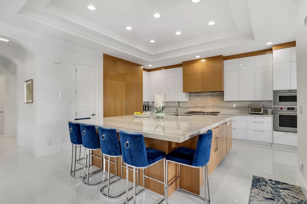 The Home in Boca Raton is a Two story Transitional Contemporary with exceptional water and expansive golf course vistas of the Fazio west golf course now available for sale. This home located at 7645 Fenwick Pl, Boca Raton, Florida