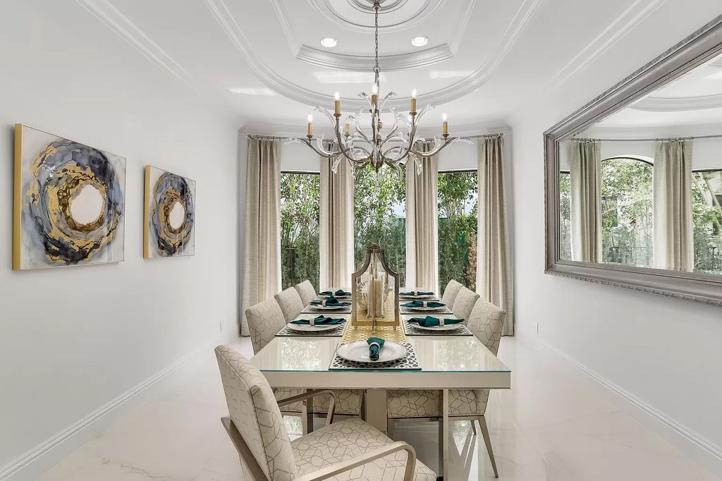 The Home in Boca Raton is a Two story Transitional Contemporary with exceptional water and expansive golf course vistas of the Fazio west golf course now available for sale. This home located at 7645 Fenwick Pl, Boca Raton, Florida