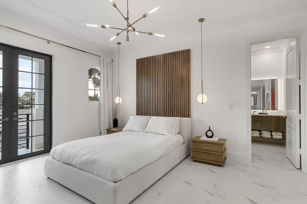 The Home in Boca Raton is a Two story Transitional Contemporary with exceptional water and expansive golf course vistas of the Fazio west golf course now available for sale. This home located at 7645 Fenwick Pl, Boca Raton, Florida