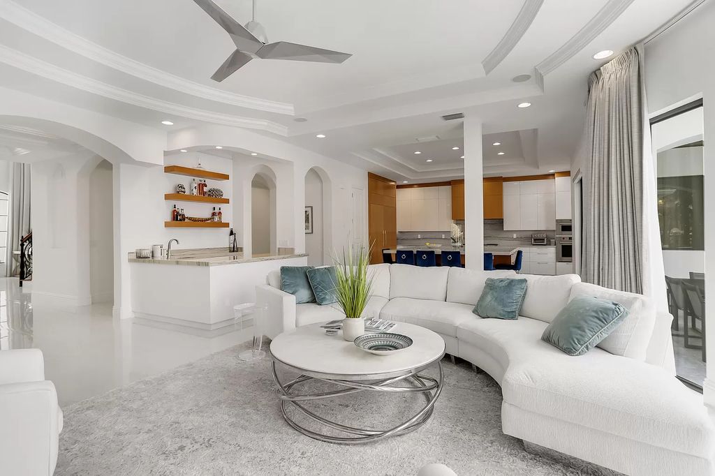 The Home in Boca Raton is a Two story Transitional Contemporary with exceptional water and expansive golf course vistas of the Fazio west golf course now available for sale. This home located at 7645 Fenwick Pl, Boca Raton, Florida
