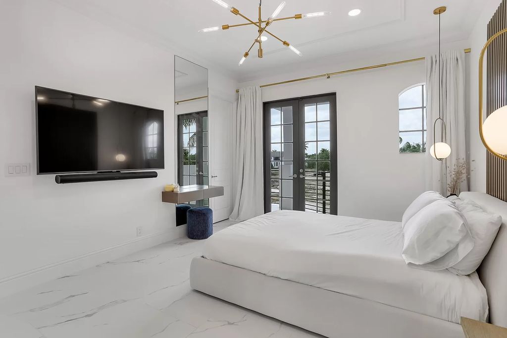 The Home in Boca Raton is a Two story Transitional Contemporary with exceptional water and expansive golf course vistas of the Fazio west golf course now available for sale. This home located at 7645 Fenwick Pl, Boca Raton, Florida