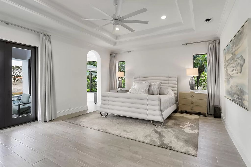 The Home in Boca Raton is a Two story Transitional Contemporary with exceptional water and expansive golf course vistas of the Fazio west golf course now available for sale. This home located at 7645 Fenwick Pl, Boca Raton, Florida