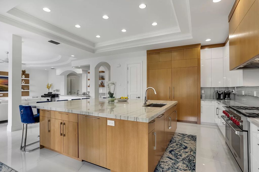 The Home in Boca Raton is a Two story Transitional Contemporary with exceptional water and expansive golf course vistas of the Fazio west golf course now available for sale. This home located at 7645 Fenwick Pl, Boca Raton, Florida
