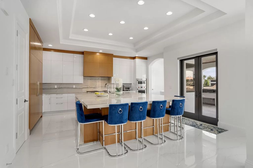 The Home in Boca Raton is a Two story Transitional Contemporary with exceptional water and expansive golf course vistas of the Fazio west golf course now available for sale. This home located at 7645 Fenwick Pl, Boca Raton, Florida