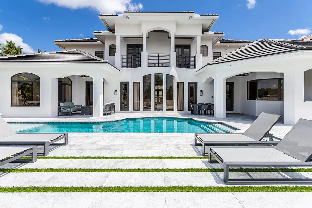 The Home in Boca Raton is a Two story Transitional Contemporary with exceptional water and expansive golf course vistas of the Fazio west golf course now available for sale. This home located at 7645 Fenwick Pl, Boca Raton, Florida