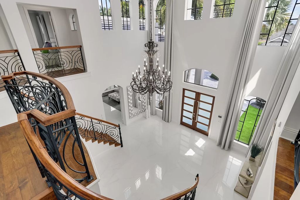 The Home in Boca Raton is a Two story Transitional Contemporary with exceptional water and expansive golf course vistas of the Fazio west golf course now available for sale. This home located at 7645 Fenwick Pl, Boca Raton, Florida
