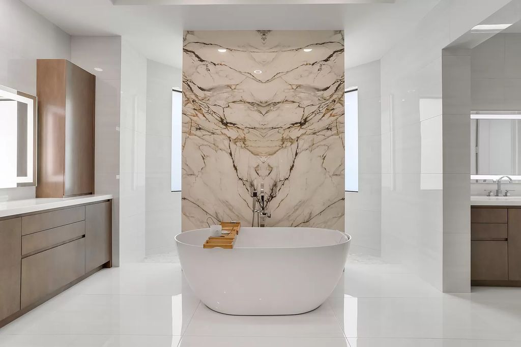 The Home in Boca Raton is a Two story Transitional Contemporary with exceptional water and expansive golf course vistas of the Fazio west golf course now available for sale. This home located at 7645 Fenwick Pl, Boca Raton, Florida