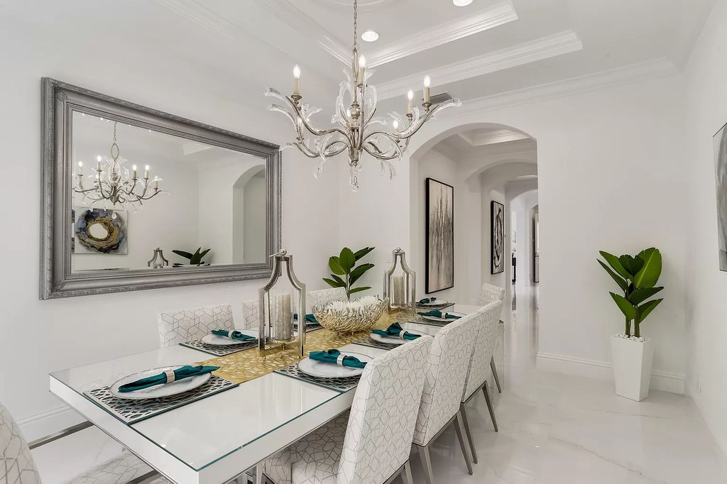The Home in Boca Raton is a Two story Transitional Contemporary with exceptional water and expansive golf course vistas of the Fazio west golf course now available for sale. This home located at 7645 Fenwick Pl, Boca Raton, Florida