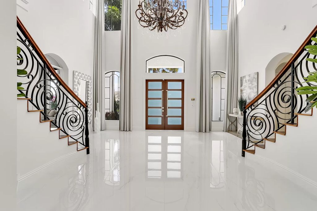 The Home in Boca Raton is a Two story Transitional Contemporary with exceptional water and expansive golf course vistas of the Fazio west golf course now available for sale. This home located at 7645 Fenwick Pl, Boca Raton, Florida