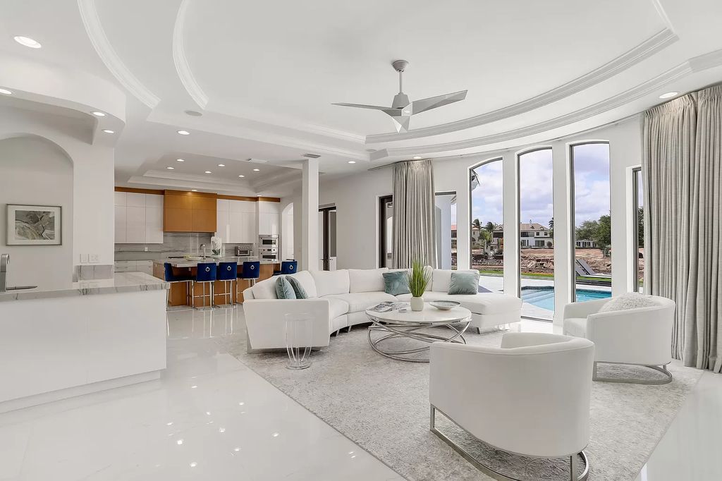 The Home in Boca Raton is a Two story Transitional Contemporary with exceptional water and expansive golf course vistas of the Fazio west golf course now available for sale. This home located at 7645 Fenwick Pl, Boca Raton, Florida