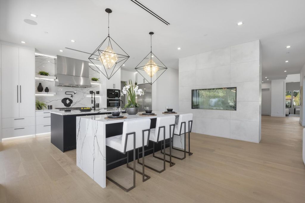 The Home in Encino is a brilliantly designed contemporary residence offers warm, indoor outdoor living with luxurious finishes now available for sale. This home located at 16706 Magnolia, Encino, California