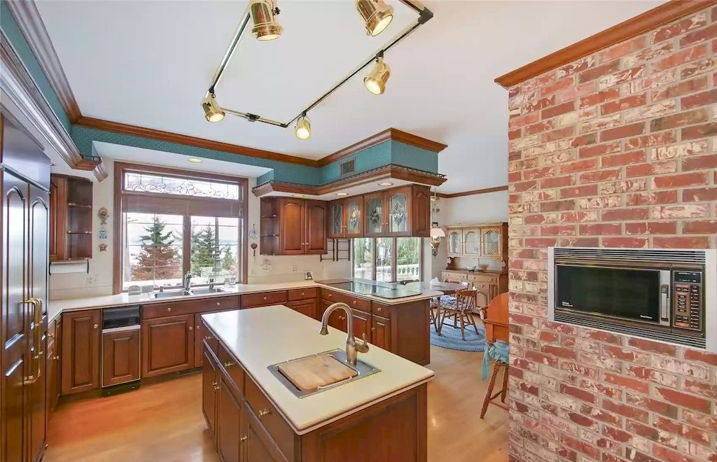 The Estate in Washington is a luxurious home located amongst mature gardens and majestic evergreens now available for sale. This home located at 17802 Talbot Rd, Edmonds, Washington; offering 04 bedrooms and 05 bathrooms with 8,200 square feet of living spaces.