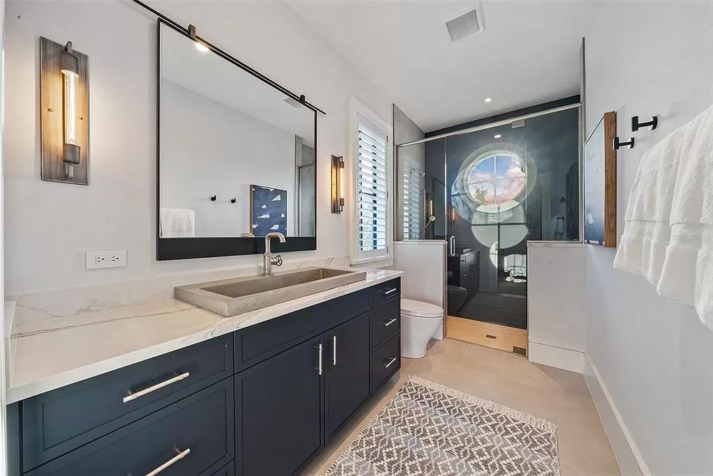 The Home in Holmes Beach is a luxurious, sprawling waterfront front estate tucked away at the end of a quiet cul de sac on desirable Anna Maria Island now available for sale. This home located at 535 70th St, Holmes Beach, Florida