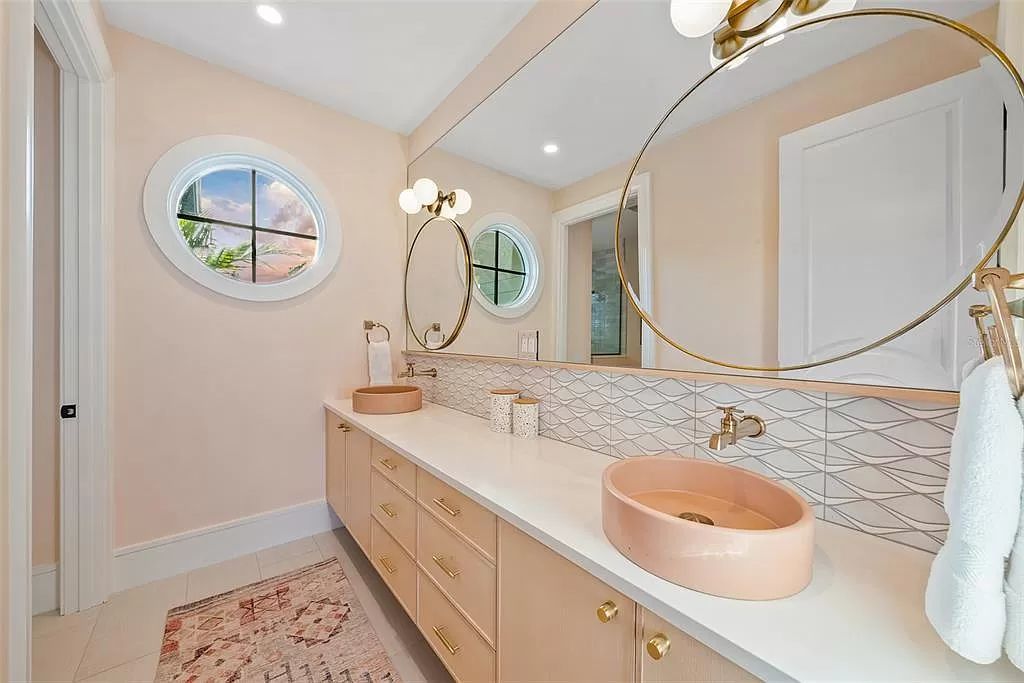 The Home in Holmes Beach is a luxurious, sprawling waterfront front estate tucked away at the end of a quiet cul de sac on desirable Anna Maria Island now available for sale. This home located at 535 70th St, Holmes Beach, Florida