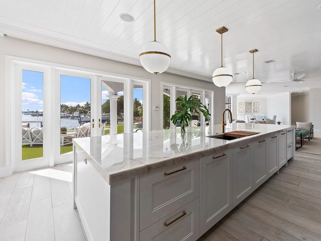 The Home in Jupiter is a newly renovated transitional custom estate with detached guest house, private tennis court and 2 gated entries for complete privacy now available for sale. This home located at 19000 Point Dr, Jupiter, Florida