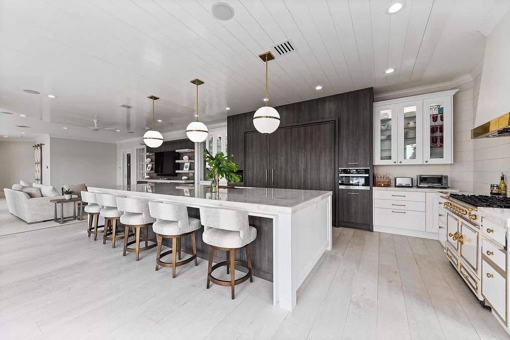 The Home in Jupiter is a newly renovated transitional custom estate with detached guest house, private tennis court and 2 gated entries for complete privacy now available for sale. This home located at 19000 Point Dr, Jupiter, Florida