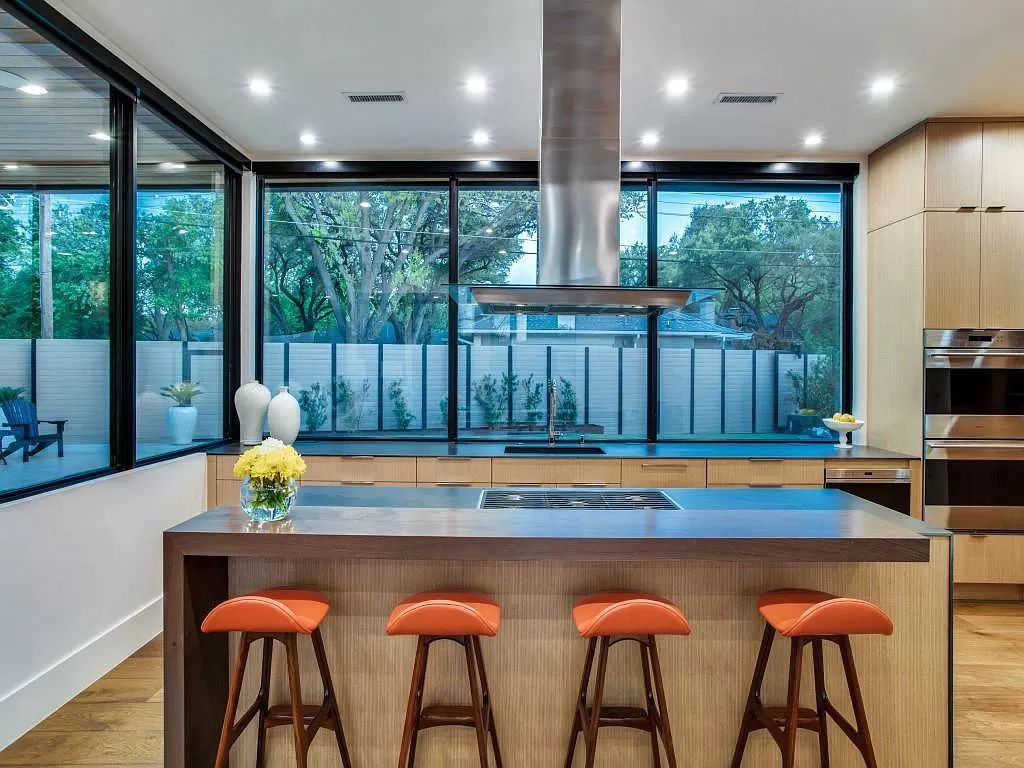 The Home in Dallas is a modern masterpiece features high-end luxury design and custom details including custom dry stacked stone, custom metal gutters, metal roof now available for sale. This home located at 5736 Stonegate Rd, Dallas, Texas