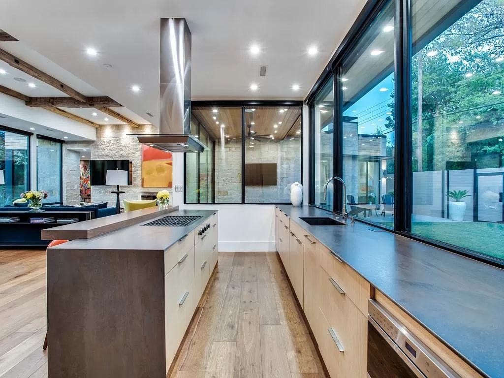 The Home in Dallas is a modern masterpiece features high-end luxury design and custom details including custom dry stacked stone, custom metal gutters, metal roof now available for sale. This home located at 5736 Stonegate Rd, Dallas, Texas