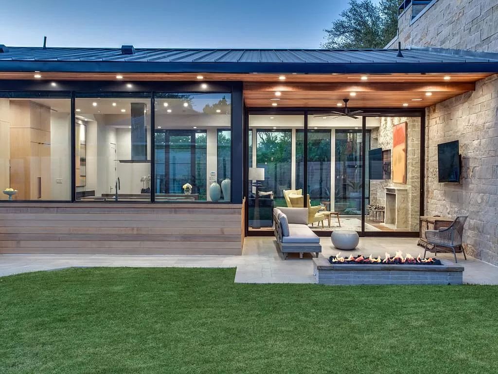 The Home in Dallas is a modern masterpiece features high-end luxury design and custom details including custom dry stacked stone, custom metal gutters, metal roof now available for sale. This home located at 5736 Stonegate Rd, Dallas, Texas