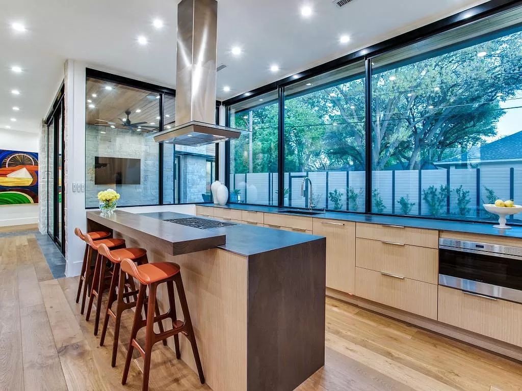 The Home in Dallas is a modern masterpiece features high-end luxury design and custom details including custom dry stacked stone, custom metal gutters, metal roof now available for sale. This home located at 5736 Stonegate Rd, Dallas, Texas