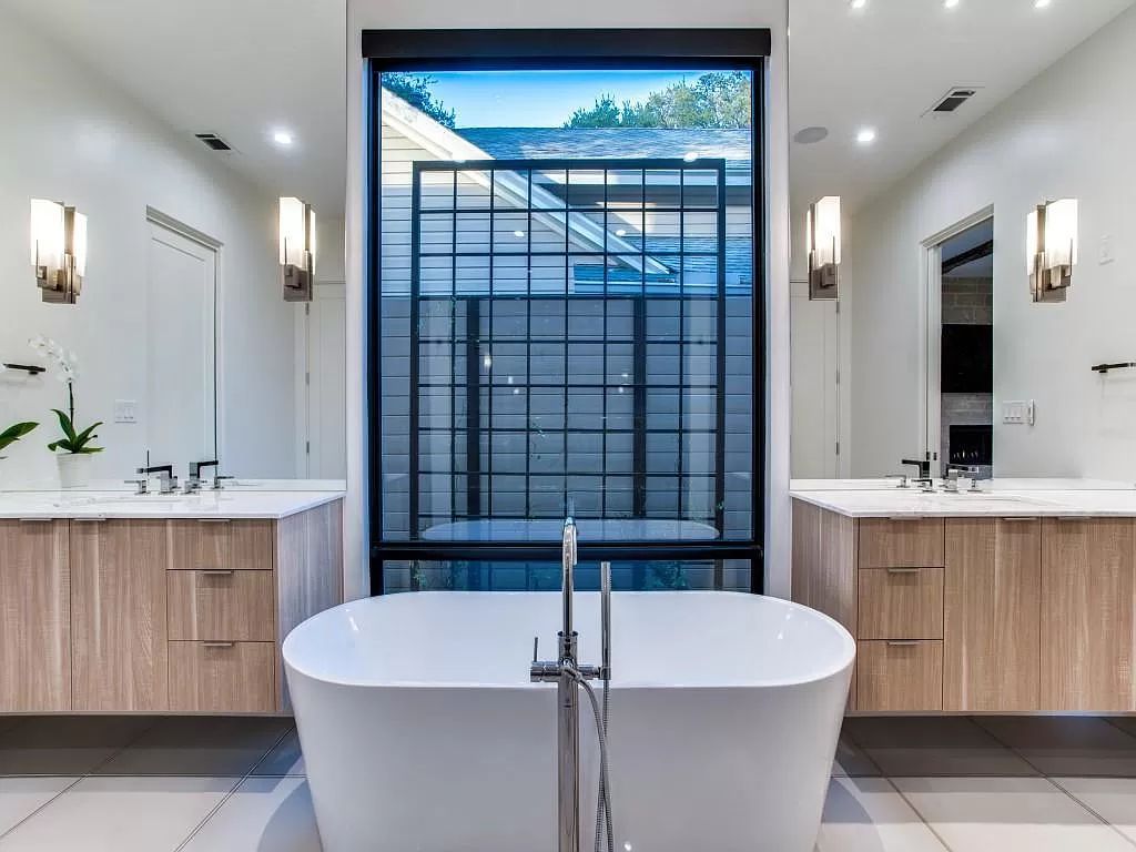 The Home in Dallas is a modern masterpiece features high-end luxury design and custom details including custom dry stacked stone, custom metal gutters, metal roof now available for sale. This home located at 5736 Stonegate Rd, Dallas, Texas