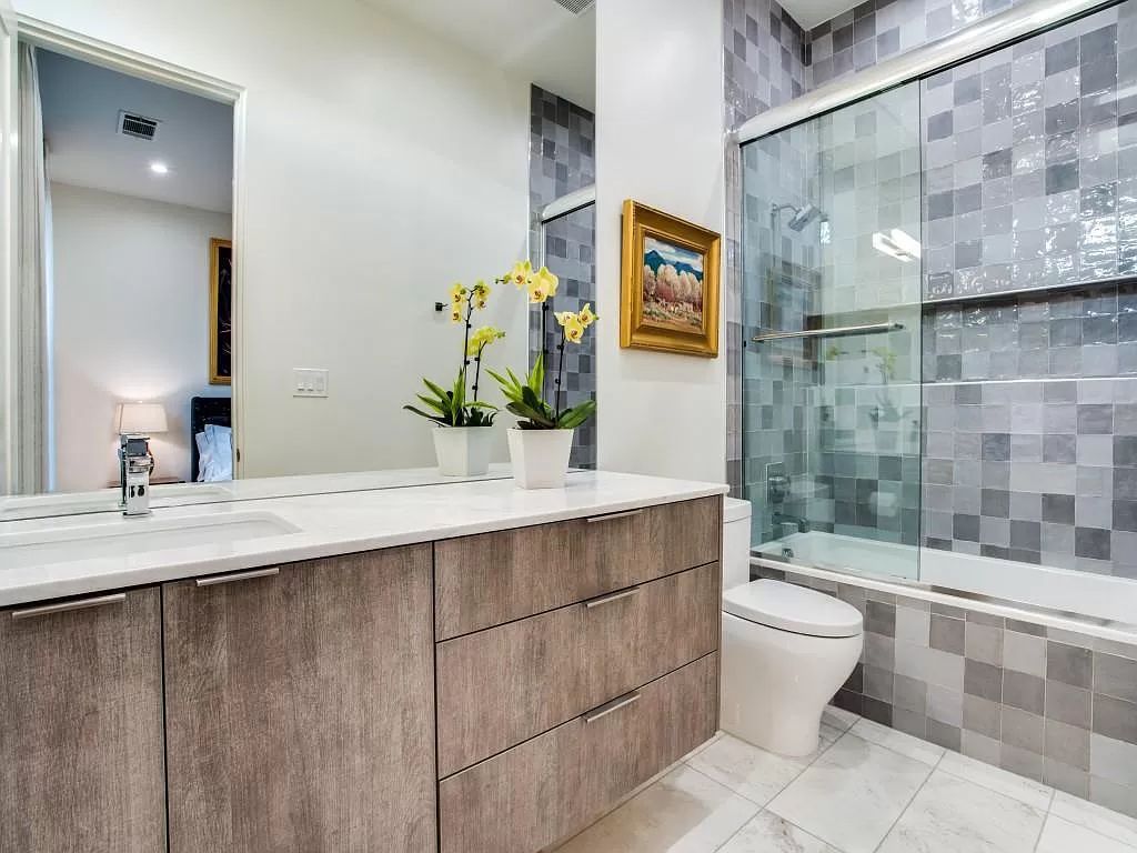The Home in Dallas is a modern masterpiece features high-end luxury design and custom details including custom dry stacked stone, custom metal gutters, metal roof now available for sale. This home located at 5736 Stonegate Rd, Dallas, Texas