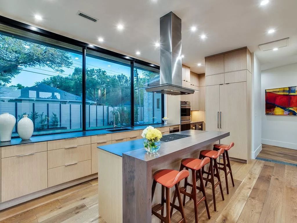 The Home in Dallas is a modern masterpiece features high-end luxury design and custom details including custom dry stacked stone, custom metal gutters, metal roof now available for sale. This home located at 5736 Stonegate Rd, Dallas, Texas