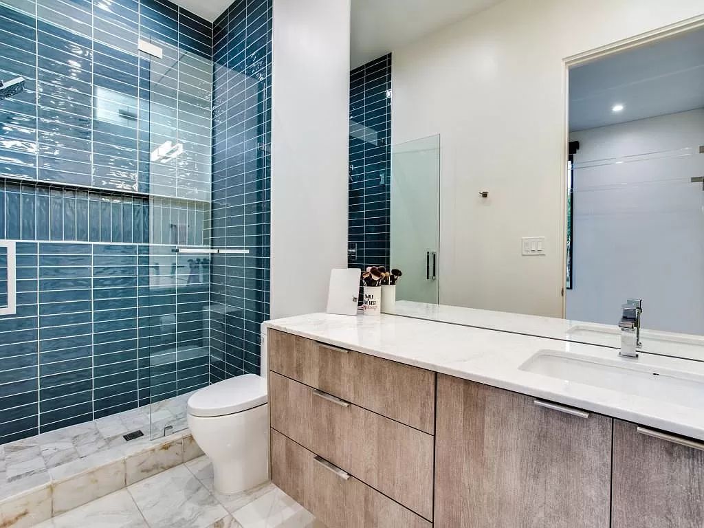 The Home in Dallas is a modern masterpiece features high-end luxury design and custom details including custom dry stacked stone, custom metal gutters, metal roof now available for sale. This home located at 5736 Stonegate Rd, Dallas, Texas