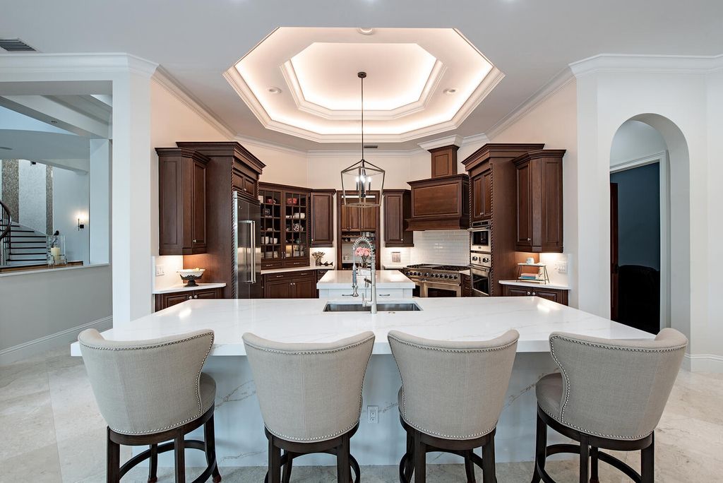 The Naples Home offers a perfect union between classically elegant architecture and contemporary finishes now available for sale. This home located at 13124 White Violet Dr, Naples, Florida