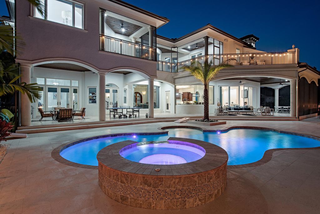 The Naples Home offers a perfect union between classically elegant architecture and contemporary finishes now available for sale. This home located at 13124 White Violet Dr, Naples, Florida