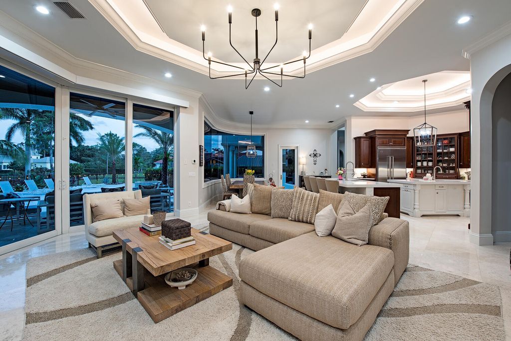 The Naples Home offers a perfect union between classically elegant architecture and contemporary finishes now available for sale. This home located at 13124 White Violet Dr, Naples, Florida