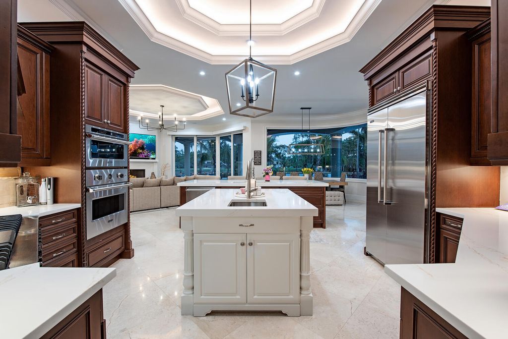 The Naples Home offers a perfect union between classically elegant architecture and contemporary finishes now available for sale. This home located at 13124 White Violet Dr, Naples, Florida