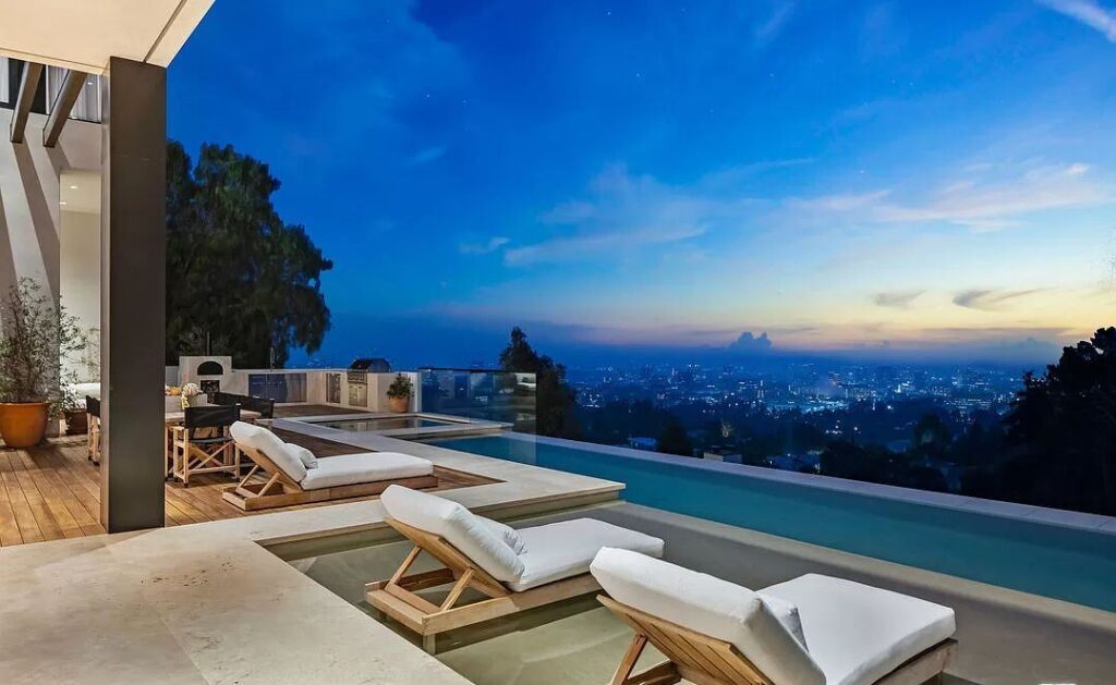 The Bel Air Mansion is a recently completed 15,000 sf contemporary masterpiece with soaring ceilings throughout, state-of-the-art amenities now available for sale. This home located at 755 Sarbonne Rd, Los Angeles, California