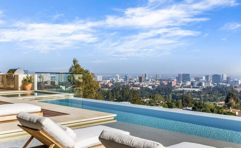 The Bel Air Mansion is a recently completed 15,000 sf contemporary masterpiece with soaring ceilings throughout, state-of-the-art amenities now available for sale. This home located at 755 Sarbonne Rd, Los Angeles, California