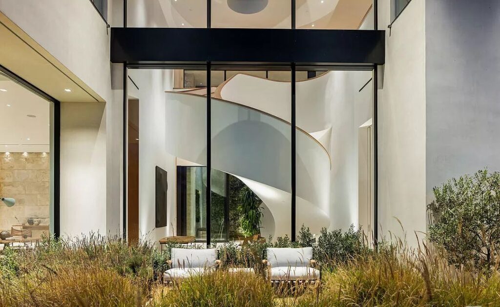 The Bel Air Mansion is a recently completed 15,000 sf contemporary masterpiece with soaring ceilings throughout, state-of-the-art amenities now available for sale. This home located at 755 Sarbonne Rd, Los Angeles, California