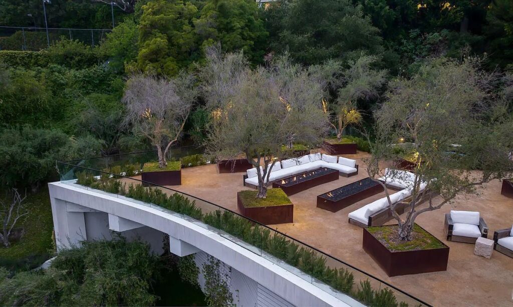 The Bel Air Mansion is a recently completed 15,000 sf contemporary masterpiece with soaring ceilings throughout, state-of-the-art amenities now available for sale. This home located at 755 Sarbonne Rd, Los Angeles, California