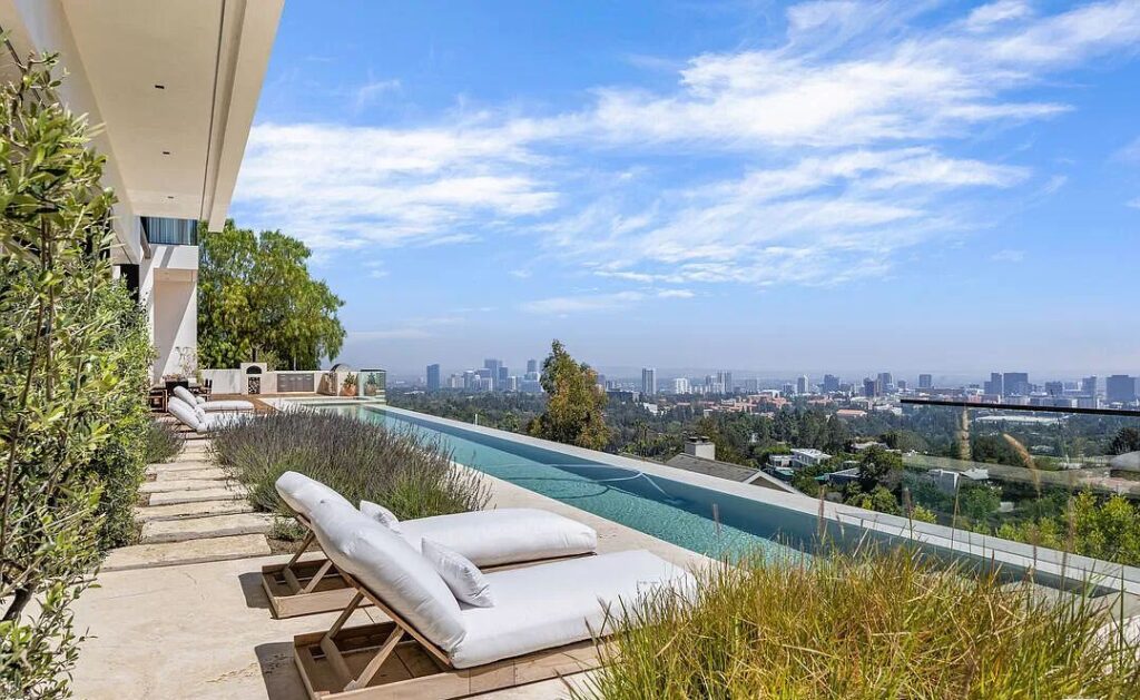 The Bel Air Mansion is a recently completed 15,000 sf contemporary masterpiece with soaring ceilings throughout, state-of-the-art amenities now available for sale. This home located at 755 Sarbonne Rd, Los Angeles, California