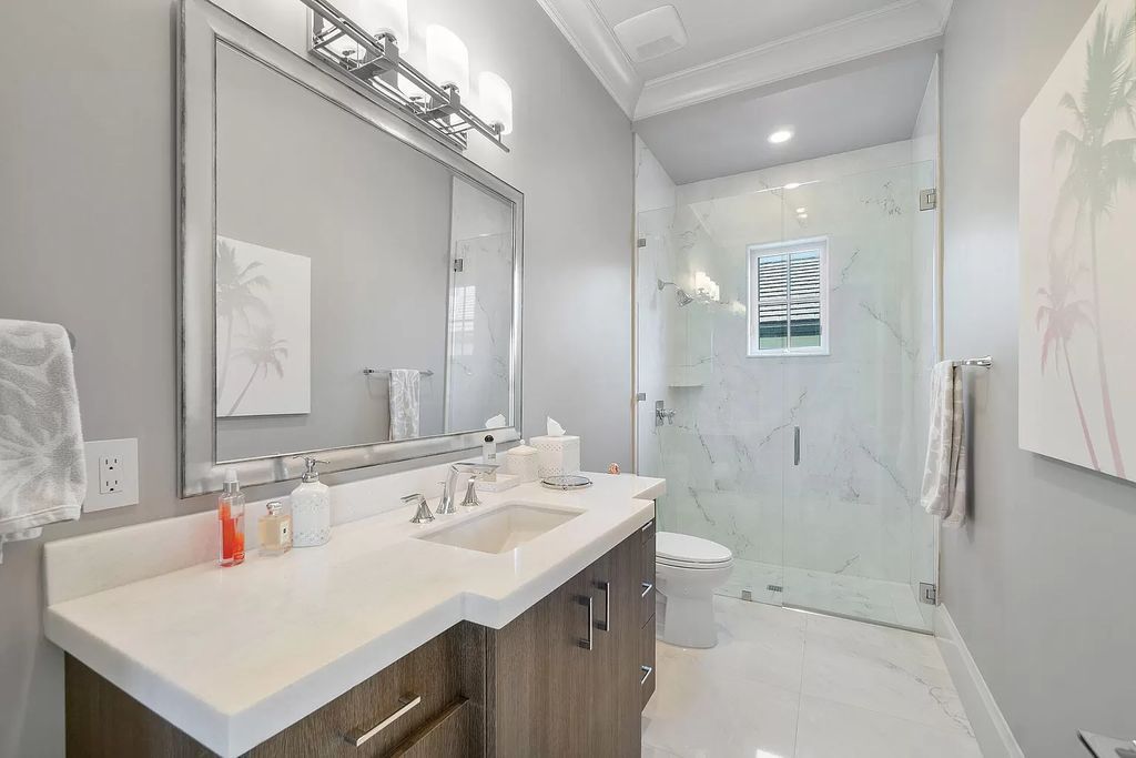 The Home in Boca Raton is a pristinely maintained transitional estate with island-inspired architectural accents now available for sale. This home located at 2155 W Silver Palm Rd, Boca Raton, Florida
