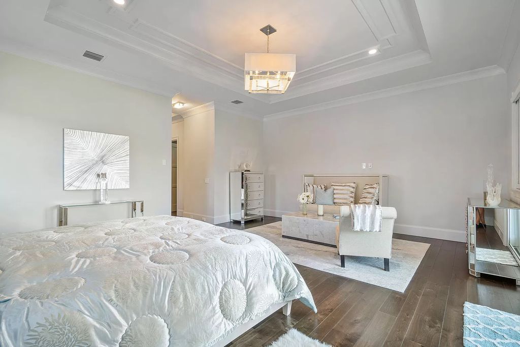 The Home in Boca Raton is a pristinely maintained transitional estate with island-inspired architectural accents now available for sale. This home located at 2155 W Silver Palm Rd, Boca Raton, Florida
