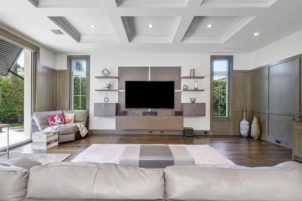 The Home in Boca Raton is a pristinely maintained transitional estate with island-inspired architectural accents now available for sale. This home located at 2155 W Silver Palm Rd, Boca Raton, Florida