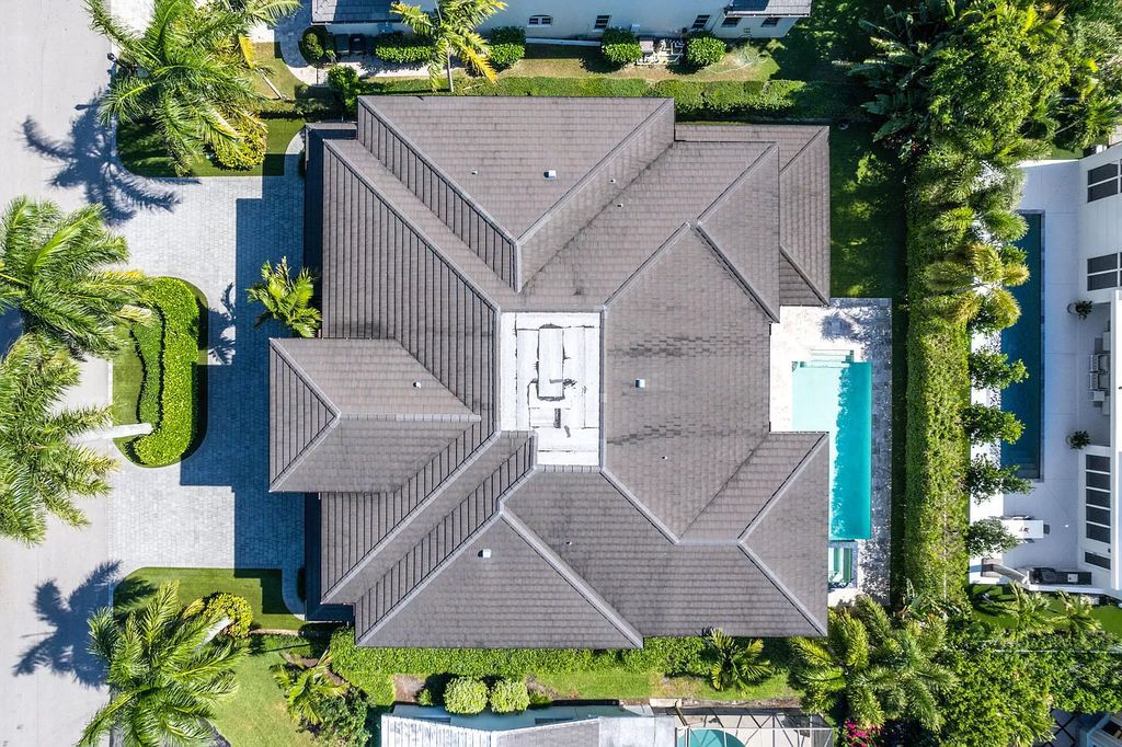 The Home in Boca Raton is a pristinely maintained transitional estate with island-inspired architectural accents now available for sale. This home located at 2155 W Silver Palm Rd, Boca Raton, Florida
