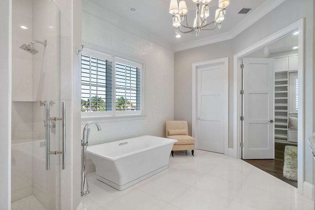 The Home in Boca Raton is a pristinely maintained transitional estate with island-inspired architectural accents now available for sale. This home located at 2155 W Silver Palm Rd, Boca Raton, Florida
