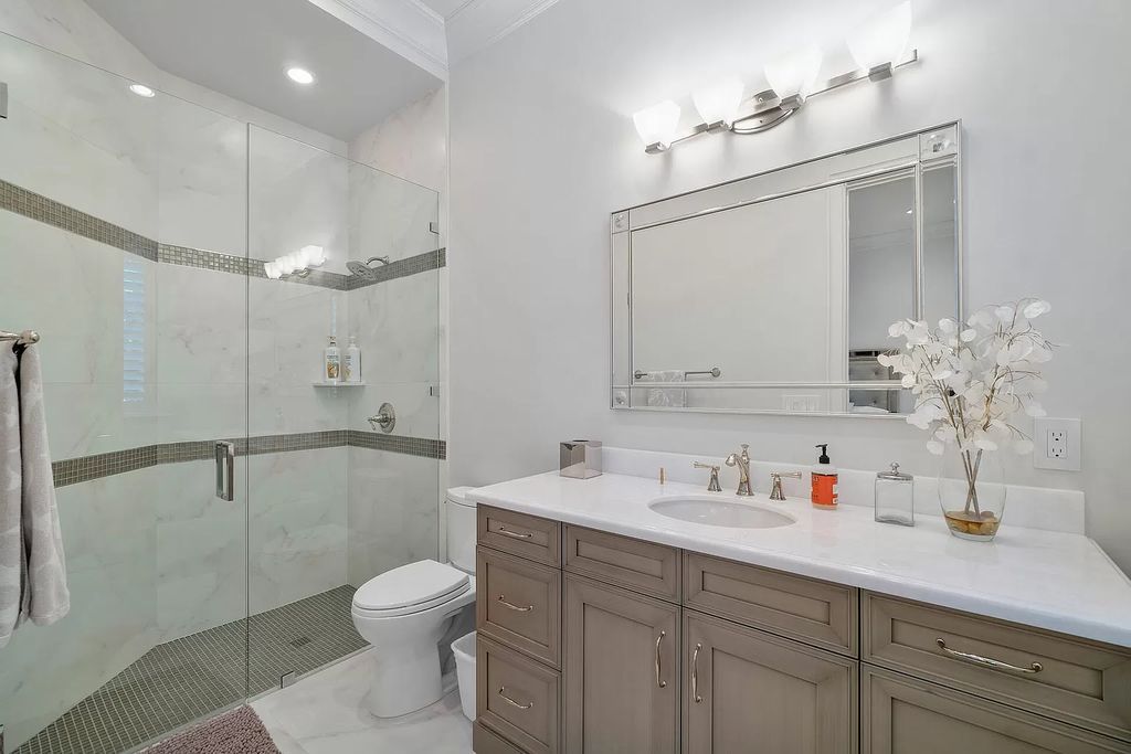 The Home in Boca Raton is a pristinely maintained transitional estate with island-inspired architectural accents now available for sale. This home located at 2155 W Silver Palm Rd, Boca Raton, Florida