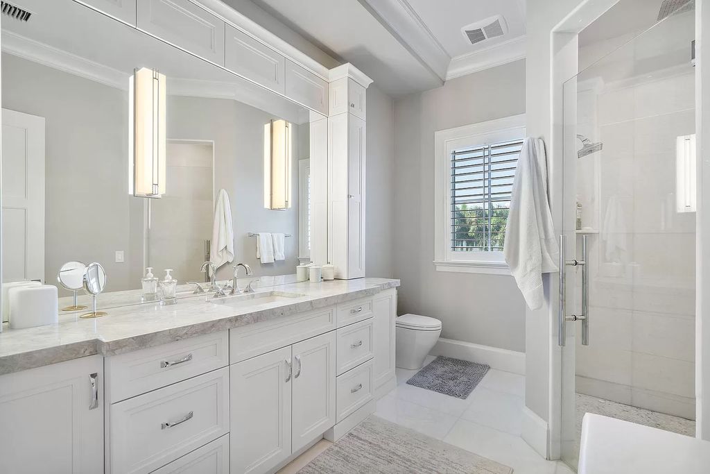 The Home in Boca Raton is a pristinely maintained transitional estate with island-inspired architectural accents now available for sale. This home located at 2155 W Silver Palm Rd, Boca Raton, Florida
