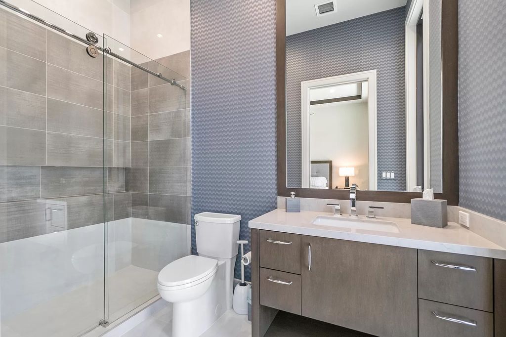 The Home in Delray Beach is a striking custom-built estate with the grand open concept, luxury finishes and modern architectural millwork now available for sale. This home located at 5526 Vintage Oaks Ter, Delray Beach, Florida