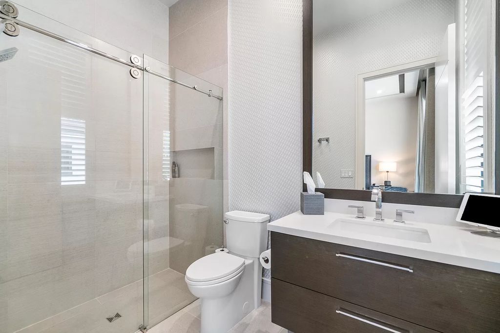 The Home in Delray Beach is a striking custom-built estate with the grand open concept, luxury finishes and modern architectural millwork now available for sale. This home located at 5526 Vintage Oaks Ter, Delray Beach, Florida