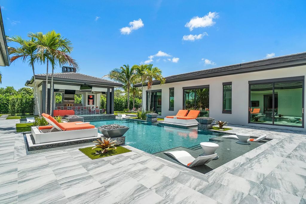 The Home in Delray Beach is a striking custom-built estate with the grand open concept, luxury finishes and modern architectural millwork now available for sale. This home located at 5526 Vintage Oaks Ter, Delray Beach, Florida